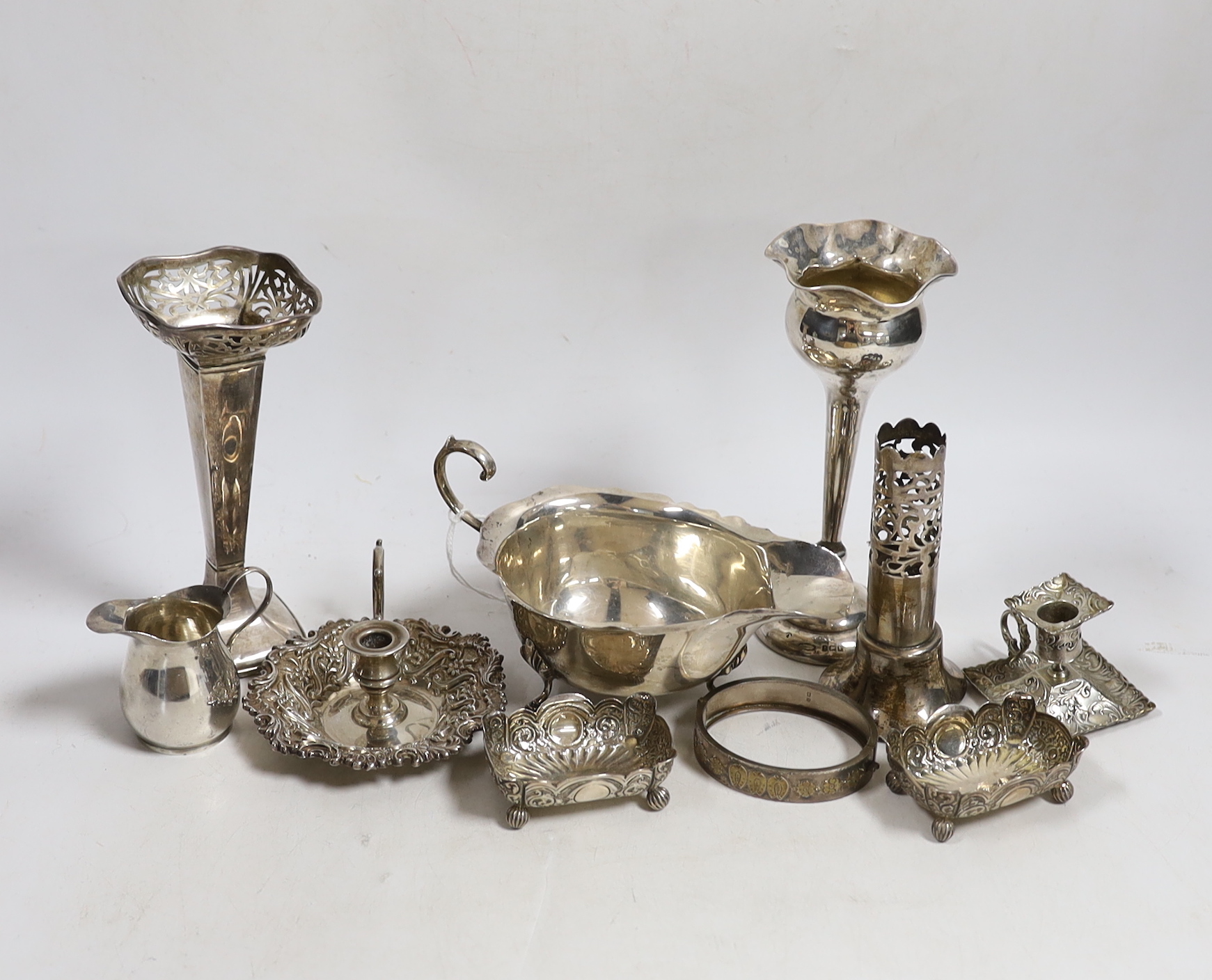Sundry small silver including a sauceboat, two mounted posy vases, pair of salts, small cream jug, mounted vase section, chamberstick and a hinged bracelet, together with a small 800 standard chamberstick.
